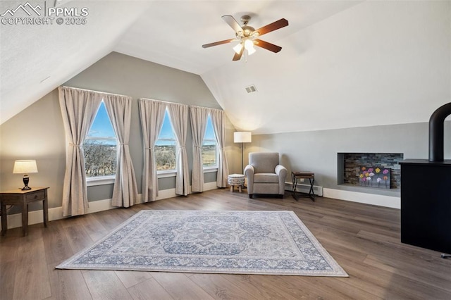 sitting room featuring plenty of natural light, wood finished floors, and visible vents