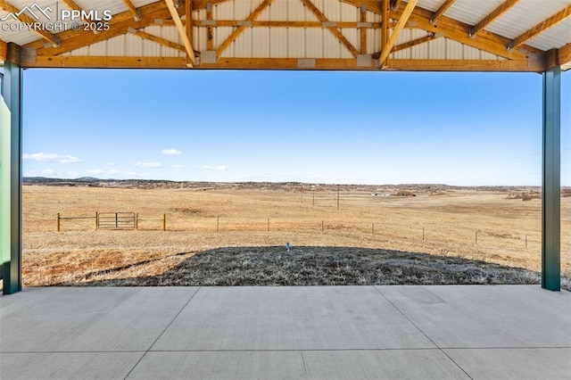 exterior space featuring fence and a rural view