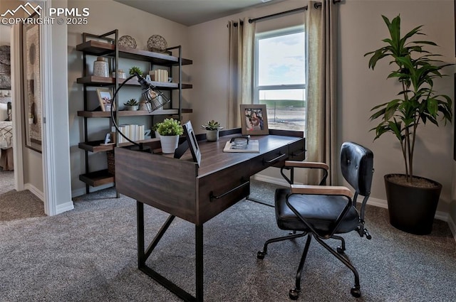 carpeted office featuring baseboards