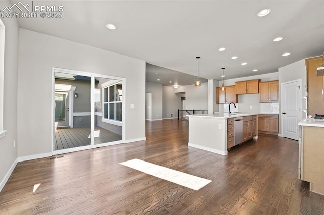 kitchen with recessed lighting, dark wood-type flooring, a sink, open floor plan, and light countertops