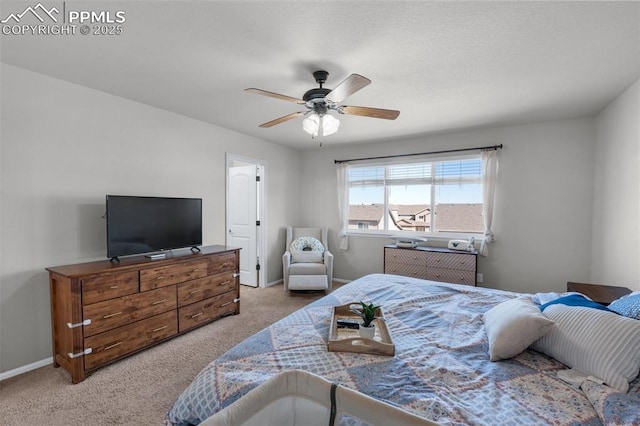 bedroom featuring a ceiling fan, carpet, and baseboards