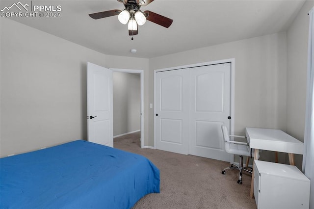 bedroom with ceiling fan, a closet, and carpet flooring