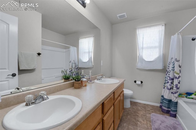 full bath featuring plenty of natural light, a sink, and visible vents