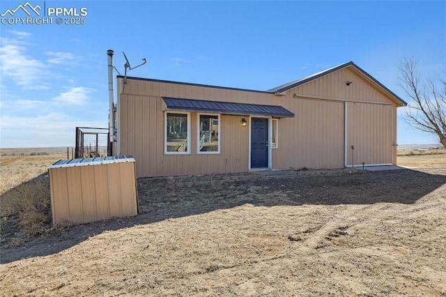 view of front of house featuring metal roof