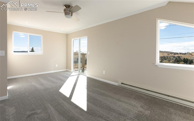 carpeted spare room featuring ornamental molding, baseboards, baseboard heating, and a ceiling fan