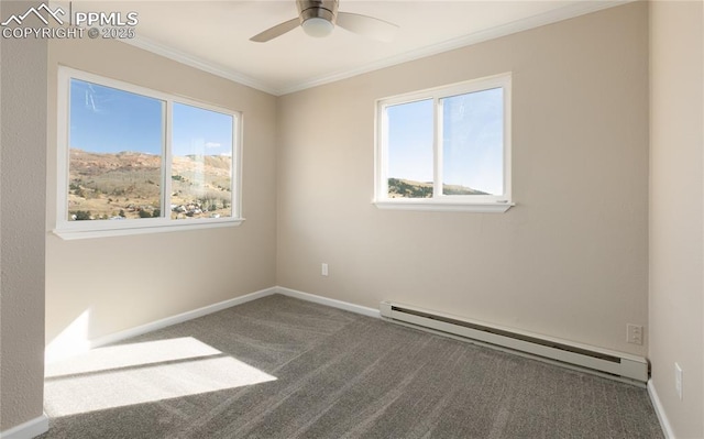 spare room with carpet floors, ornamental molding, a baseboard radiator, and a wealth of natural light