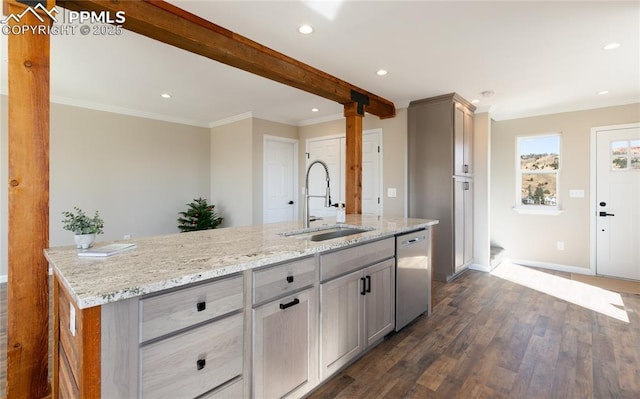 kitchen with a sink, beam ceiling, light stone countertops, dishwasher, and dark wood finished floors