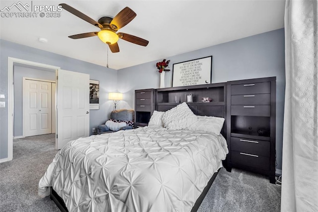 carpeted bedroom with ceiling fan and baseboards