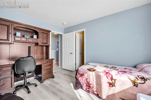 bedroom featuring light wood-type flooring