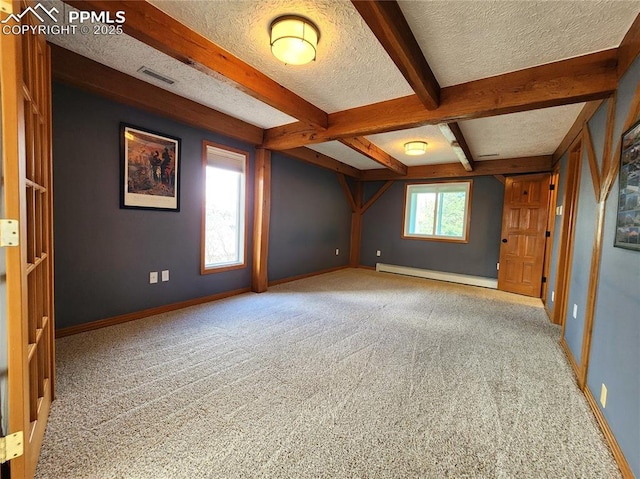 spare room featuring baseboards, carpet, beamed ceiling, a textured ceiling, and a baseboard radiator