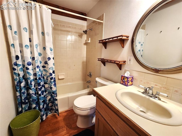 bathroom with shower / bath combo with shower curtain, toilet, wood finished floors, decorative backsplash, and vanity