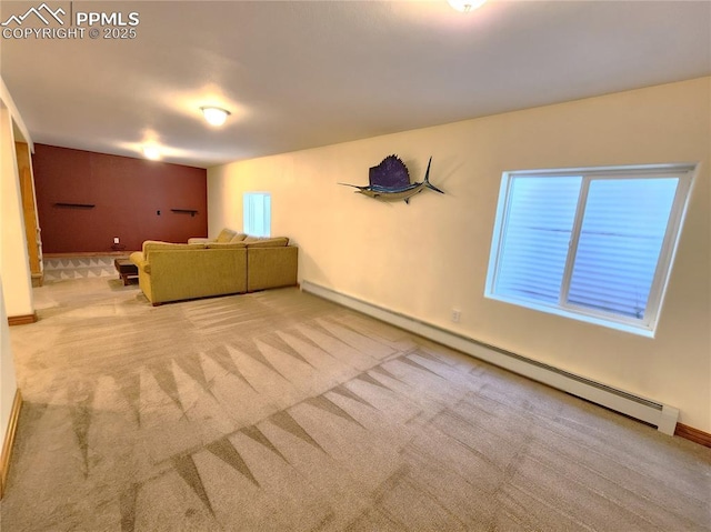 unfurnished living room featuring carpet, baseboards, and baseboard heating