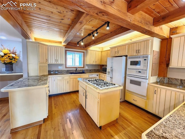 kitchen featuring a sink, white appliances, light wood-style flooring, and wooden ceiling