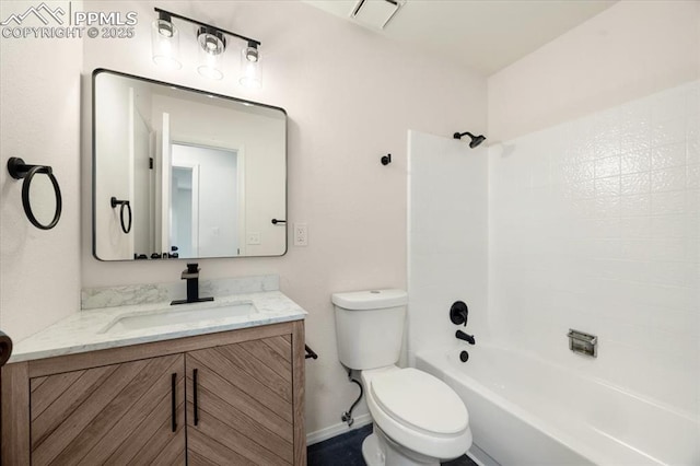 bathroom with visible vents, toilet, tub / shower combination, vanity, and baseboards