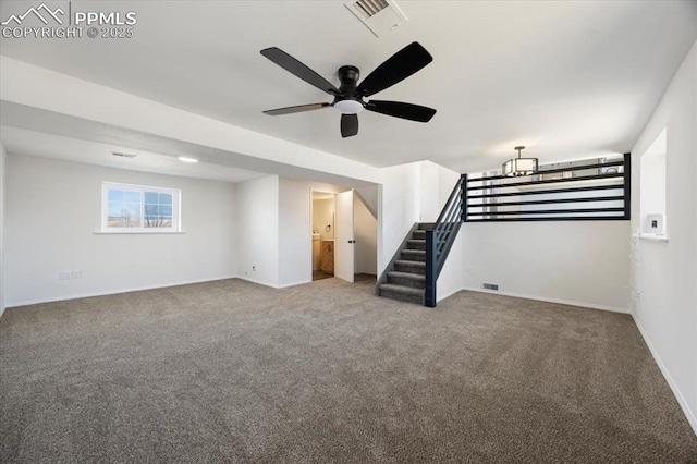 below grade area featuring stairs, carpet flooring, visible vents, and baseboards