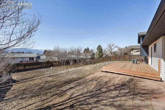 view of yard with a fenced backyard, a patio, and a wooden deck