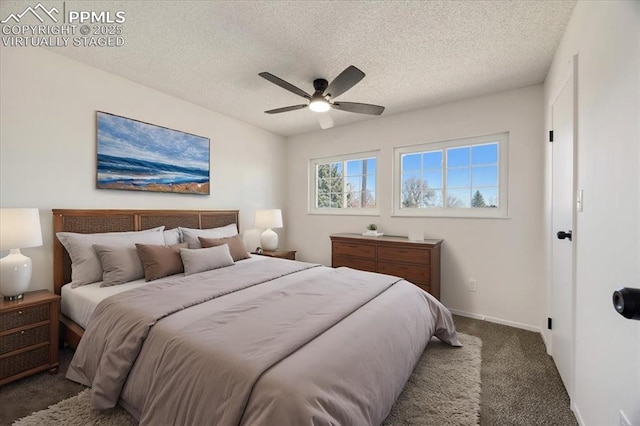 bedroom with a ceiling fan, carpet flooring, a textured ceiling, and baseboards