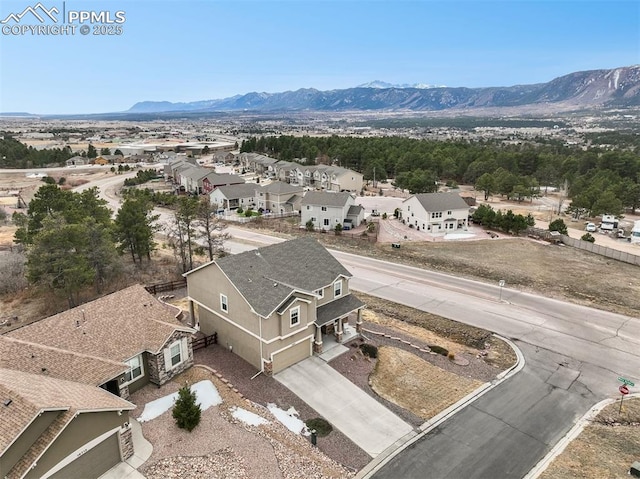 bird's eye view featuring a mountain view and a residential view