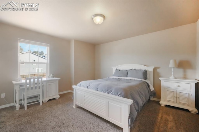 carpeted bedroom featuring baseboards