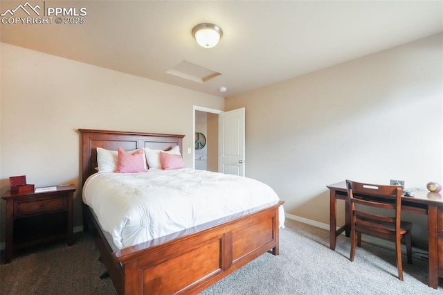 bedroom with baseboards, carpet floors, and attic access