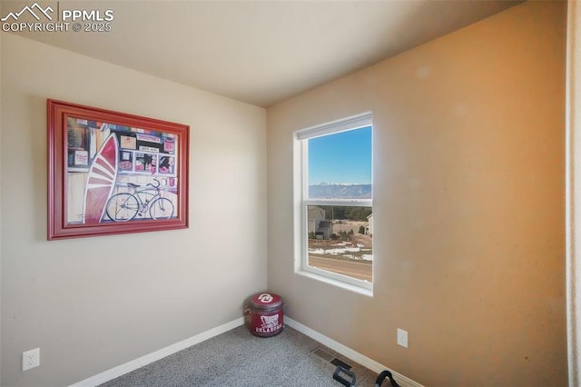 interior space with visible vents, baseboards, and carpet flooring