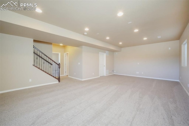 empty room featuring visible vents, recessed lighting, stairway, baseboards, and light colored carpet