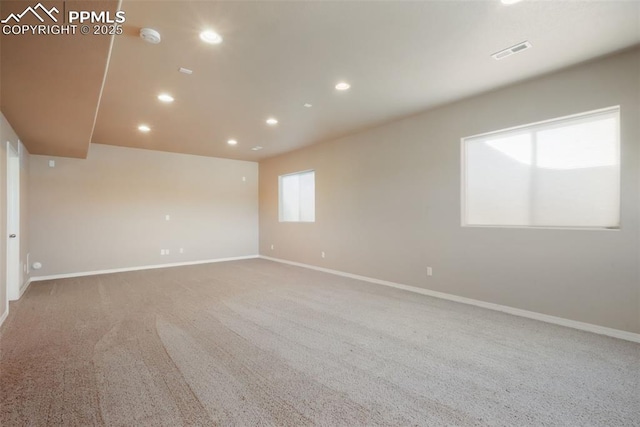 carpeted empty room with visible vents, recessed lighting, and baseboards