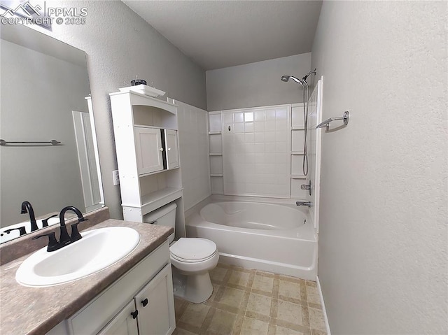 bathroom with a textured wall, toilet, tile patterned floors, bathtub / shower combination, and vanity