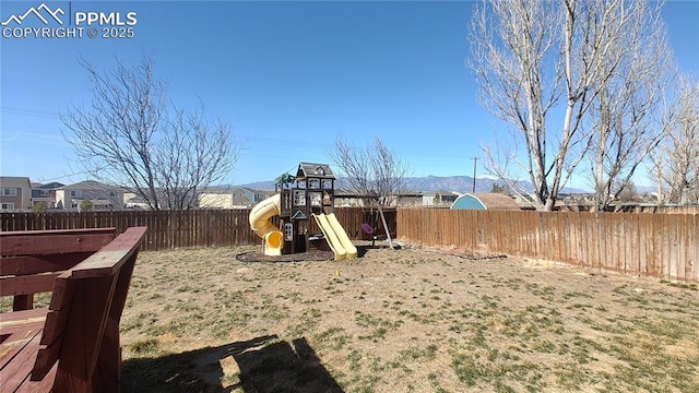 view of playground with a fenced backyard