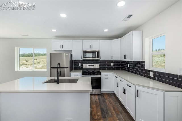 kitchen featuring recessed lighting, white cabinetry, visible vents, appliances with stainless steel finishes, and dark wood-style floors