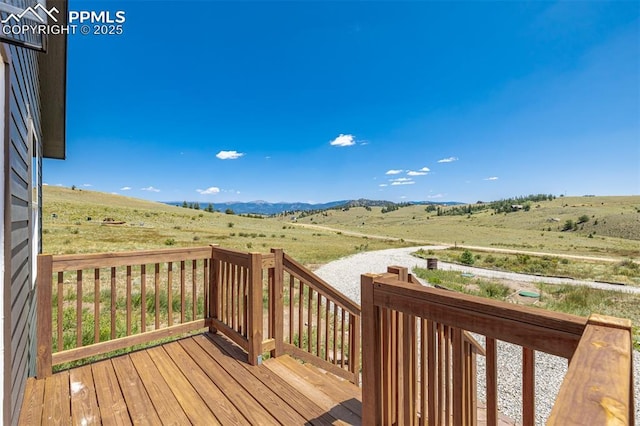 wooden terrace with a mountain view