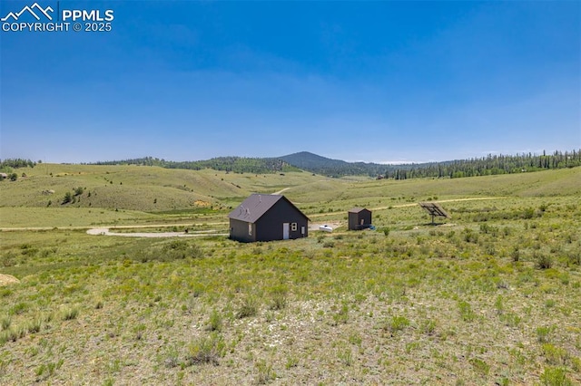 property view of mountains featuring a rural view