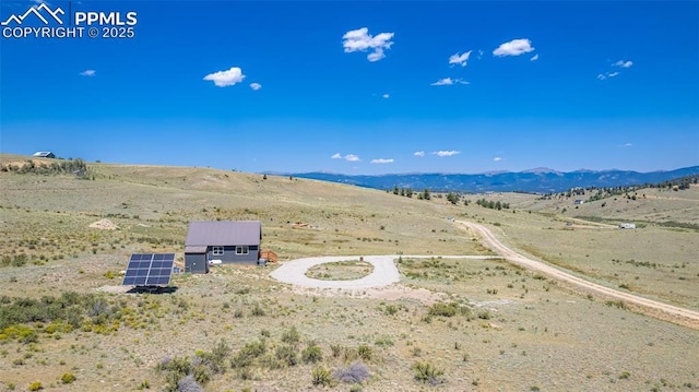 bird's eye view with a rural view and a mountain view