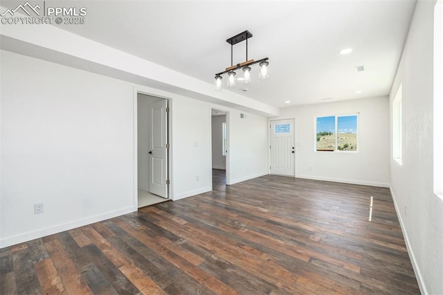 unfurnished room with dark wood-style floors, recessed lighting, and baseboards