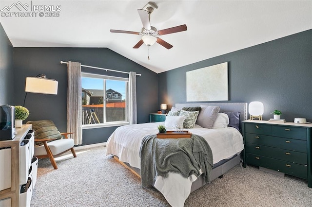 bedroom with lofted ceiling, ceiling fan, and light colored carpet