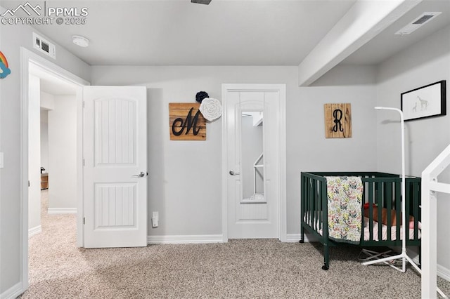 bedroom with carpet, visible vents, and baseboards