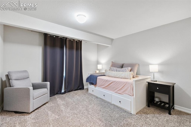 bedroom featuring light carpet and baseboards