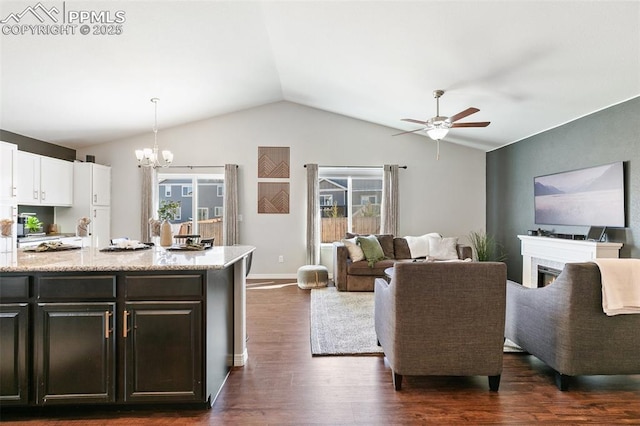 kitchen with open floor plan, vaulted ceiling, dark wood-style floors, and white cabinets