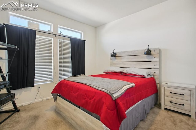 carpeted bedroom with baseboards