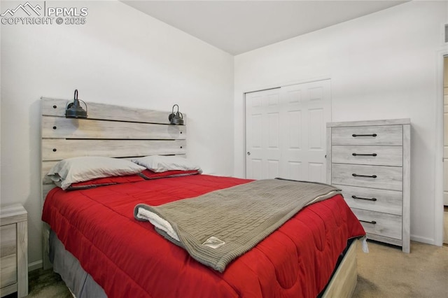 bedroom featuring carpet, baseboards, and a closet