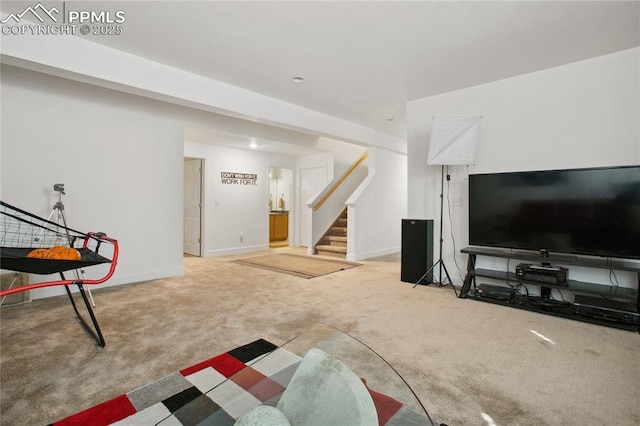 living area with stairway, carpet flooring, and baseboards