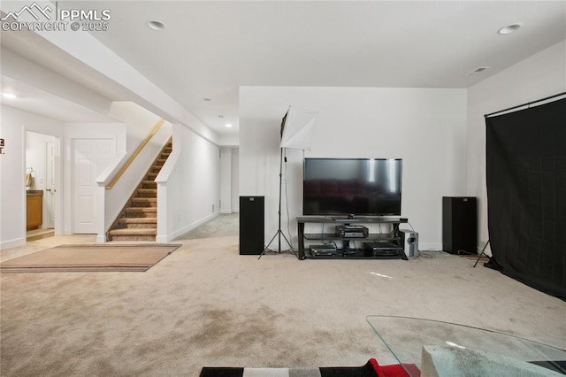 living area featuring carpet floors, recessed lighting, baseboards, and stairs