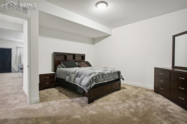 carpeted bedroom with baseboards