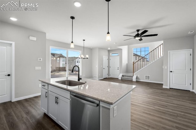 6395 Laud Pt, Colorado Springs, CO 80924 - kitchen featuring dishwasher, a sink, dark wood-style flooring, pendant lighting, and ceiling fan