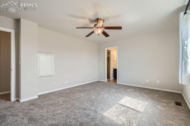 unfurnished bedroom featuring carpet floors, visible vents, and baseboards