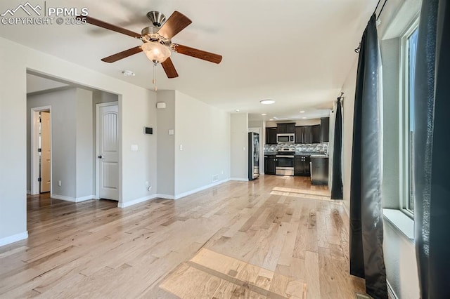 unfurnished living room featuring light wood-type flooring, ceiling fan, baseboards, and recessed lighting