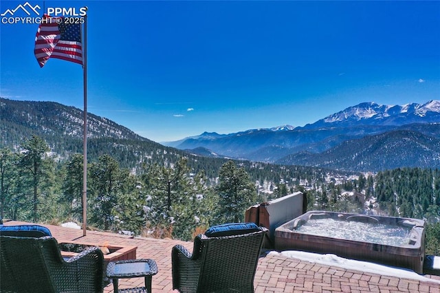 property view of mountains with a wooded view