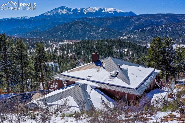 mountain view featuring a view of trees