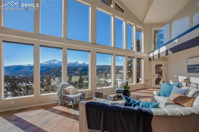 sunroom / solarium featuring a mountain view