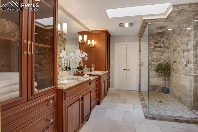 bathroom with two vanities, a sink, and a shower stall